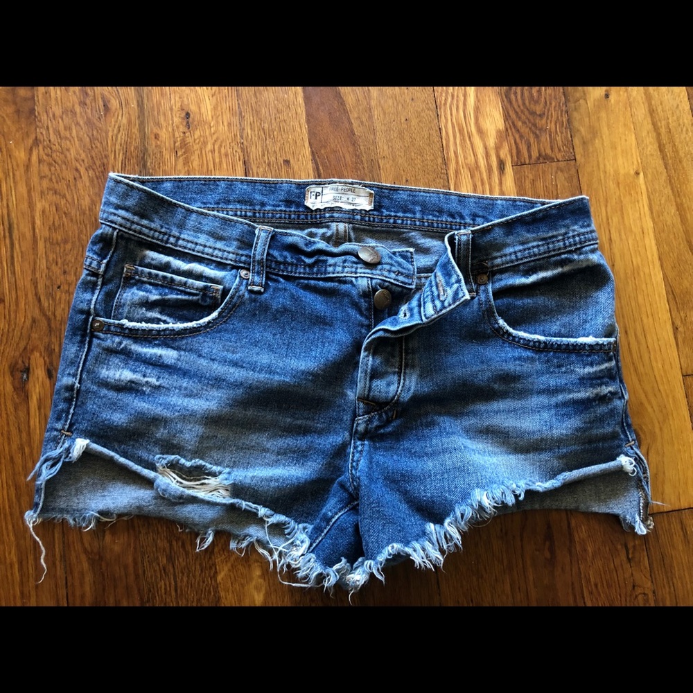 EUC Free People cut off denim fringe shorts